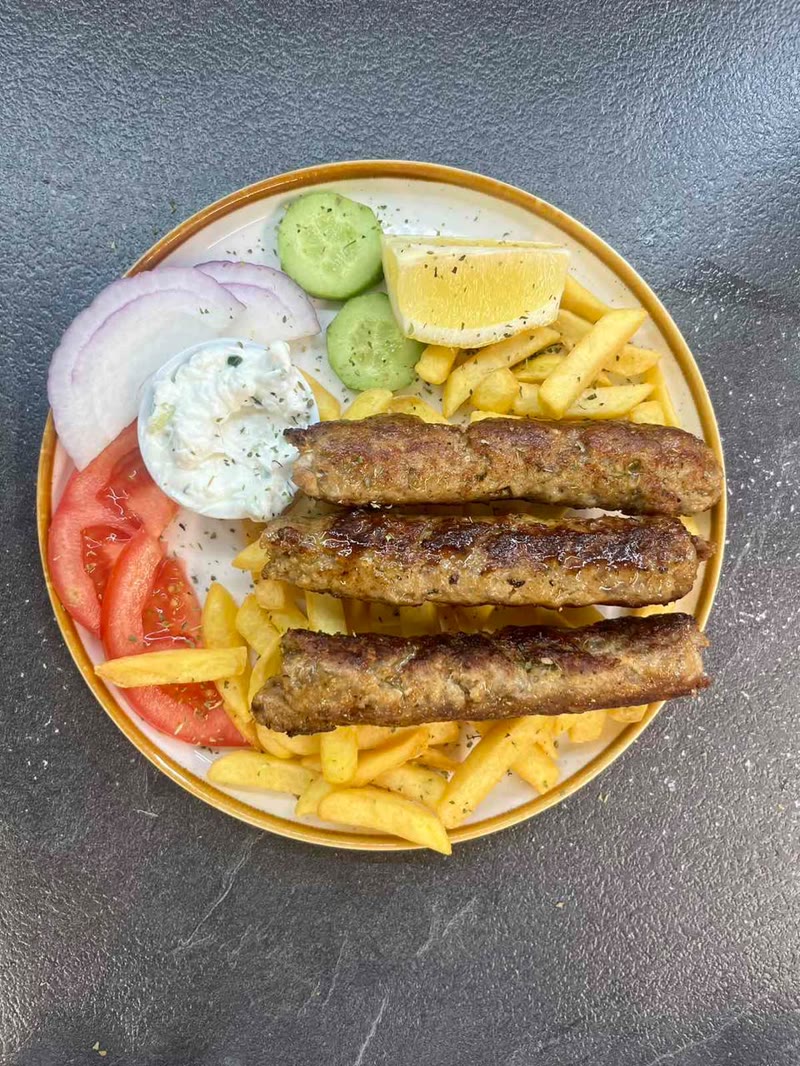 Greek kebabs with fries and tzatziki
